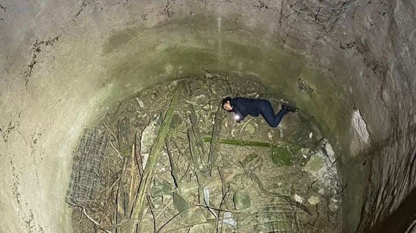 Foto de una mujer que cayó a un pozo.