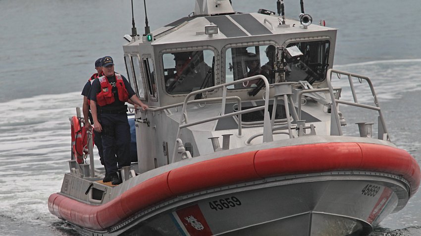 BOSTON – SEPTEMBER 27: A US Coast Guard boat brings Nathan Carman to a Coast Guard base in Boston on Sept. 27, 2016, after surviving the sinking of his 32-foot fishing boat near Block Canyon, off New York, in the Atlantic Ocean on Sept. 18. He was picked up in a lifeboat about 100 nautical miles south of Martha’s Vineyard on Sept. 25 by a Chinese freighter. His mother, who was on the “Chicken Pox” with him, has not been found. (Photo by Suzanne Kreiter/The Boston Globe via Getty Images)