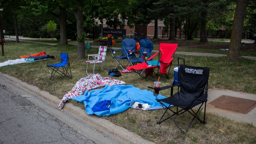 Chairs and blankets are left abandoned after a shooting at a Fourth of July parade on July 4, 2022 in Highland Park, Illinois. Reports indicate at least five people were killed and 19 injured in the mass shooting.