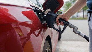 Close-up of unrecognizable man refueling car at gas station