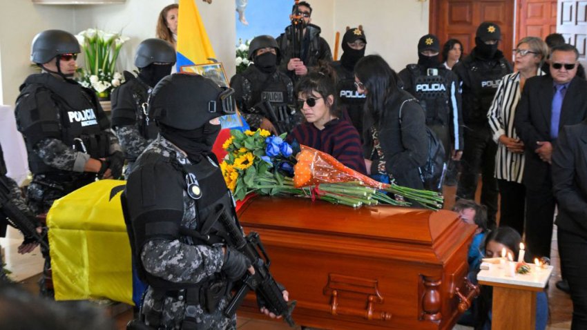 Amanda Villavicencio, daughter of slain Ecuadorean presidential candidate Fernando Villavicencio, stands by his coffin during his funeral in Quito on August 11, 2023. Ecuador declared a state of emergency Thursday and asked the FBI to help probe the assassination of a popular presidential candidate, whose death has highlighted the once-peaceful nation’s decline into a violent hotbed of drug trafficking and organized crime. (Photo by Rodrigo BUENDIA / AFP) (Photo by RODRIGO BUENDIA/AFP via Getty Images)