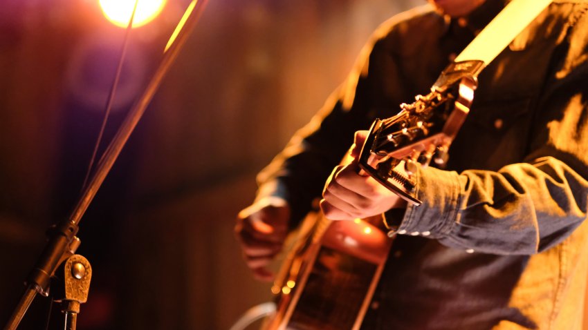 Singer-songwriter singing songs at live stage in Tokyo, Japan