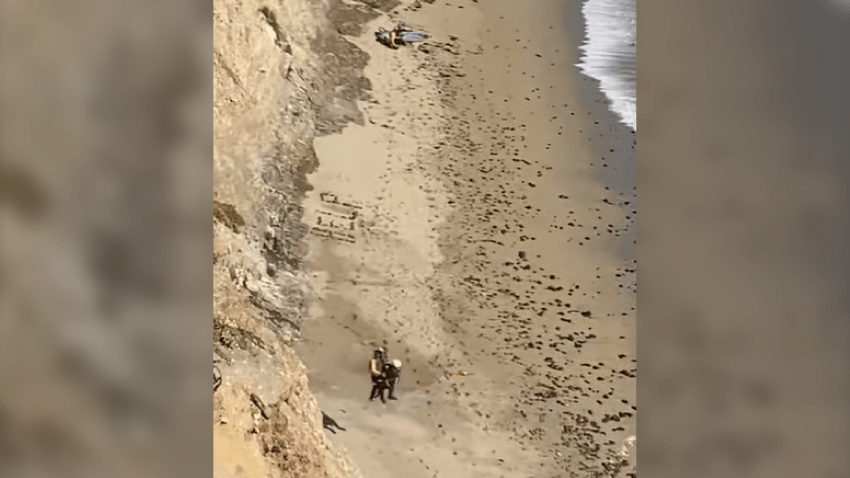 A stranded kite surfer is hoisted to safety in Santa Cruz County.