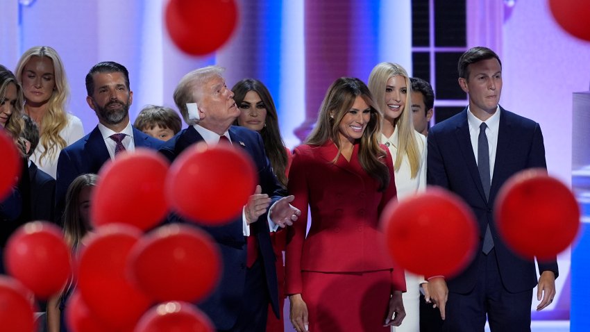 Balloons fall after the nomination of Republican presidential candidate former President Donald Trump, second from the left, at the Republican National Convention Thursday, July 18, 2024, in Milwaukee. Also on stage with him are from l-r., Donald Trump Jr.. former first lady Melania Trump, Ivanka Trump, Jared Kushner, and other Trump family members. (AP Photo/J. Scott Applewhite)