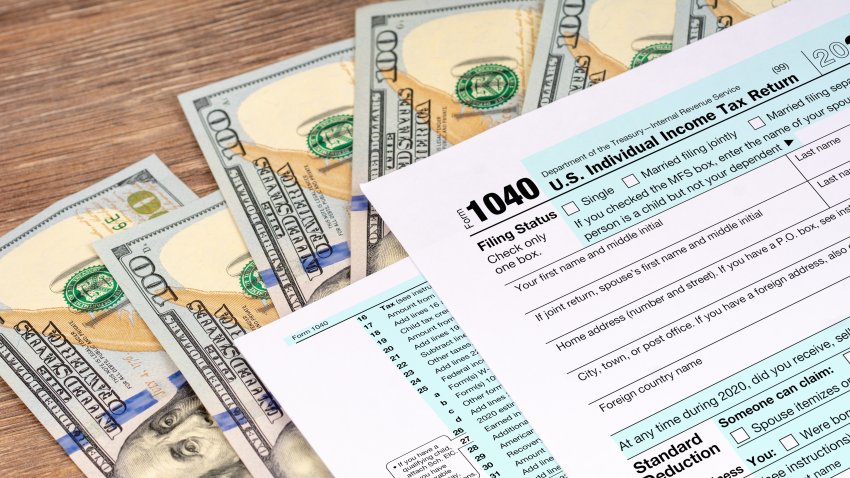 tax return application form with dollar banknotes