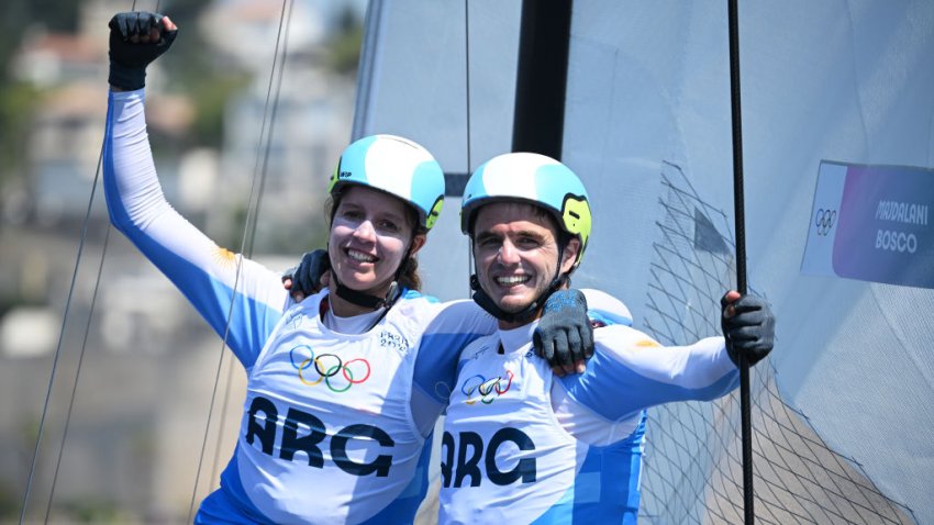 MARSEILLE, FRANCE – AUGUST 08: Mateo Majdalani and Eugenia Bosco of Team Argentina celebrate winning the silver medal after competing in the Sailing Mixed Multihull Nacra Medal Race on day thirteen of the Olympic Games Paris 2024 at Marseille Marina on August 08, 2024 in Marseille, France. (Photo by Clive Mason/Getty Images)