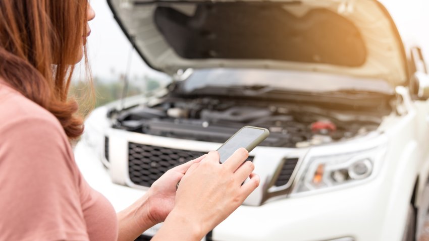 girl calling for help while her car broke down