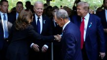 TOPSHOT - US Vice President and Democratic presidential candidate Kamala Harris (L) shakes hands with former US President and Republican presidential candidate Donald Trump (R) as former Mayor of New York Michael Bloomberg (C) and US President Joe Biden (2L) look on during a remembrance ceremony on the 23rd anniversary of the September 11 terror attack on the World Trade Center at Ground Zero, in New York City on September 11, 2024. (Photo by Adam GRAY / AFP) (Photo by ADAM GRAY/AFP via Getty Images)