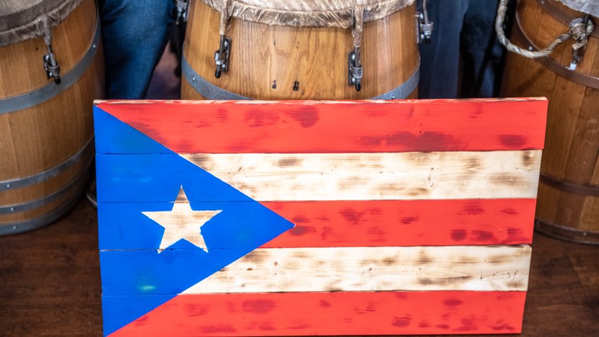 People gather to enjoy the music and dance of Cultura Planera, a Puerto Rican bomba y plena tradition, Sandy Spring, Maryland, USA. (Photo by: Edwin Remsberg/VWPics/Universal Images Group via Getty Images)