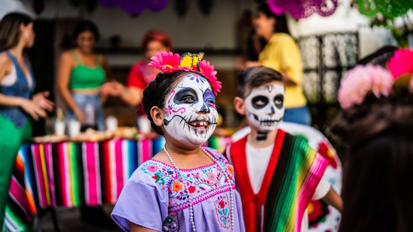 Kids playing during day of the death celebration outdoors