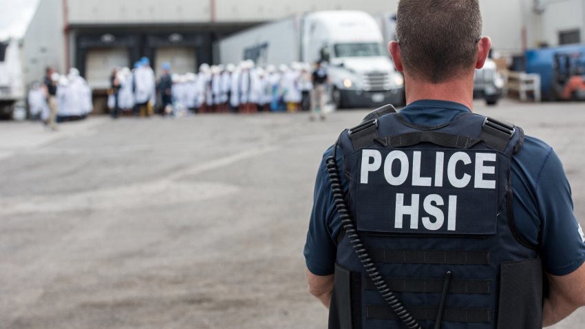 Homeland Security Investigations (HSI) special agent preparing to arrest alleged immigration violators at Fresh Mark, Salem, June 19, 2018. Image courtesy ICE ICE / U.S. Immigration and Customs Enforcement. (Photo by Smith Collection/Gado/Getty Images)