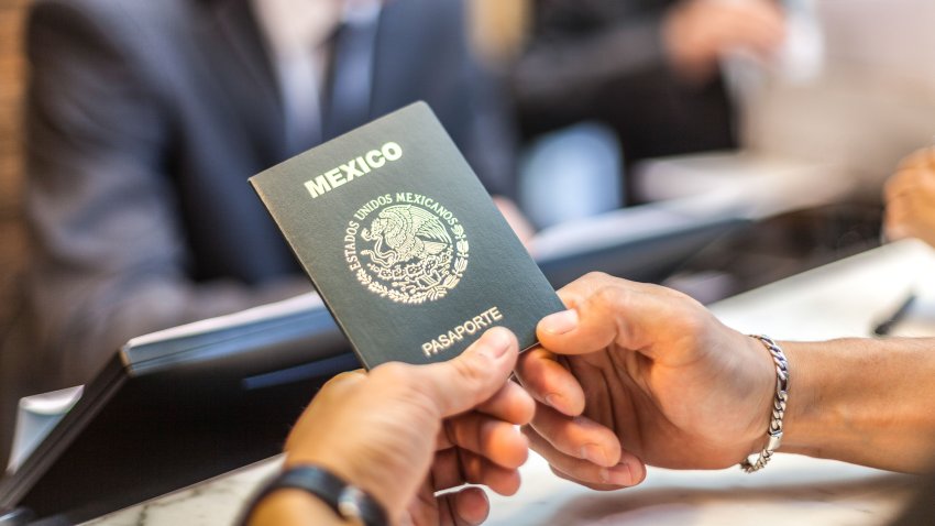 A mexican passport waiting to be taken for a hotel check in