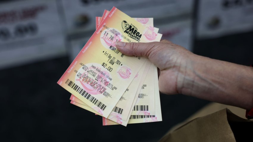 MIAMI, FLORIDA – DECEMBER 26: A customer plays Mega Millions lottery at the Downtown Miami Souvenirs store on December 26, 2024 in Miami, Florida. The Mega Millions jackpot has climbed to $1.15 billion ahead of Friday’s drawing, making it the fifth-largest prize in the game’s history and the largest prize ever offered in the month of December (Photo by Joe Raedle/Getty Images)