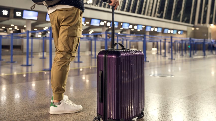 Tourists in the airport terminal.