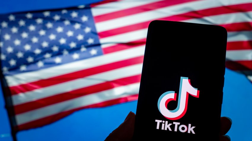 CHONGQING, CHINA – JANUARY 9, 2025 – A TikTok logo is displayed on a smartphone with the U.S. flag in the background in Chongqing, China, Jan. 9, 2025. (Photo credit should read CFOTO/Future Publishing via Getty Images)