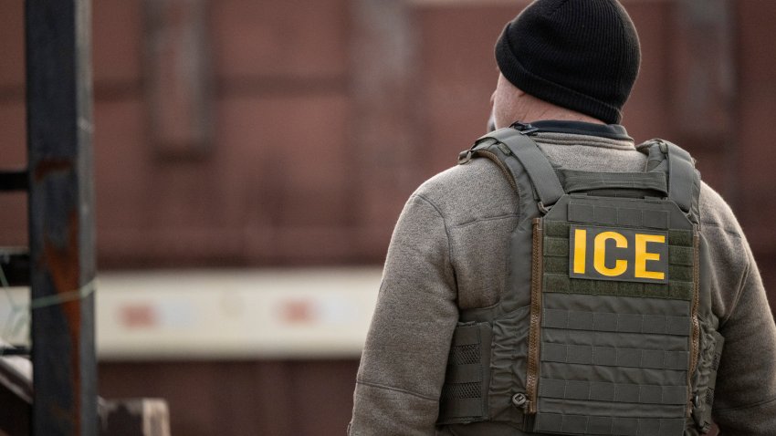 A US Immigration and Customs Enforcement (ICE) agent stands on a street during a multi-agency targeted enforcement operation in Chicago, Illinois, US, on Sunday, Jan. 26, 2025. President Donald Trump has pledged to carry out the largest deportation effort in US history, vowing to ultimately deport all of the foreigners living in the country without permission. Photographer: Christopher Dilts/Bloomberg via Getty Images