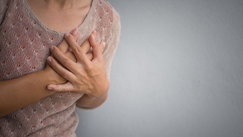 Woman having a pain in the heart attact. Medical and health care concept.