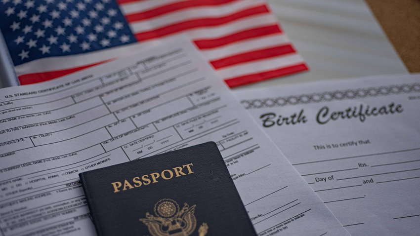 U.S. standard certificate of live birth application form next to American flag, Passport of USA and Birth Certificate template. USA Birthright citizenship concept.