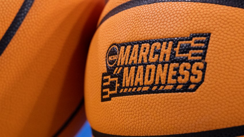 Two basketballs sit on the floor before a second-round college basketball game between UCLA and Oklahoma in the NCAA Tournament, Monday, March 20, 2023, in Los Angeles, Calif. (AP Photo/Kyusung Gong)