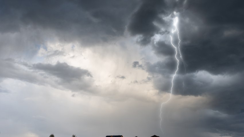 Cloud storm sky with thunderbolt over the village in rural scene.