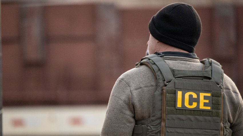 A US Immigration and Customs Enforcement (ICE) agent stands on a street during a multi-agency targeted enforcement operation in Chicago, Illinois, US, on Sunday, Jan. 26, 2025. President Donald Trump has pledged to carry out the largest deportation effort in US history, vowing to ultimately deport all of the foreigners living in the country without permission. Photographer: Christopher Dilts/Bloomberg via Getty Images