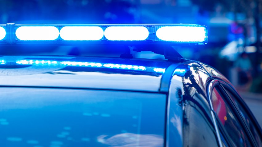 Generic blue police lights on a car during the daytime.