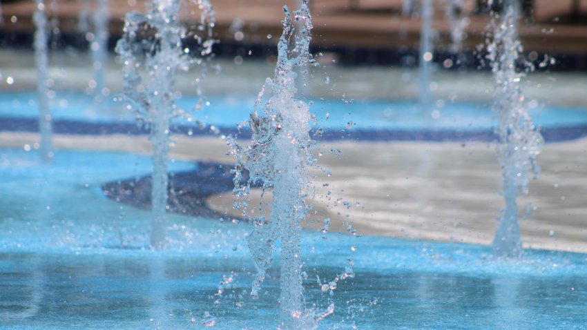 Water spraying out of the bottom of a pool.
