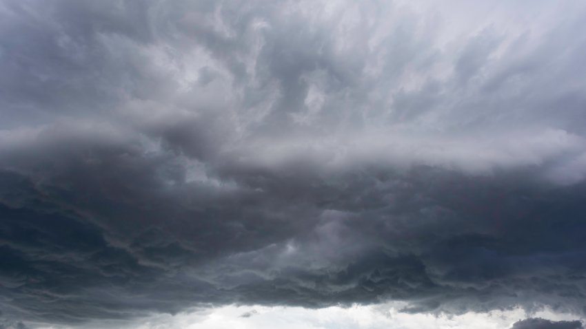 Full frame of a low angle shot of a gray sky with clouds of rain.