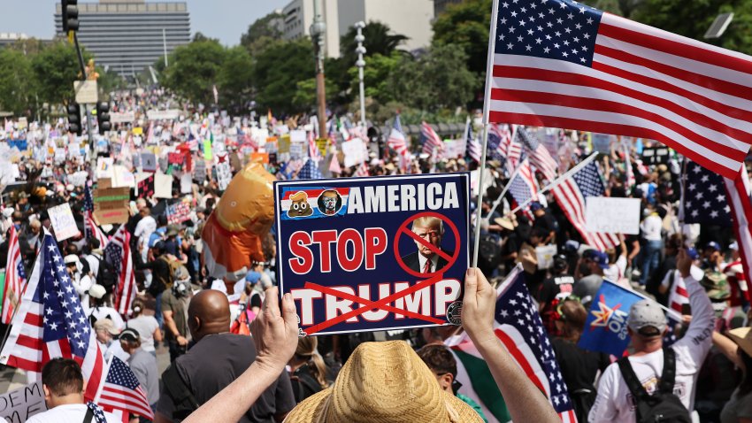 LOS ANGELES, CALIFORNIA – JUNE 14: Protesters rally in downtown Los Angeles during an anti-Trump “No Kings Day” demonstration in a city that has been the focus of protests against Trump’s immigration raids on June 14, 2025 in Los Angeles, California. Hundreds of marches and protests against the Trump administration and its policies are happening across the United States today. Protesters are also reacting in opposition to a planned military parade celebrating the 250th anniversary of the U.S. Army that is taking place in Washington, DC and which coincides with President Trump’s birthday.  (Photo by Mario Tama/Getty Images)