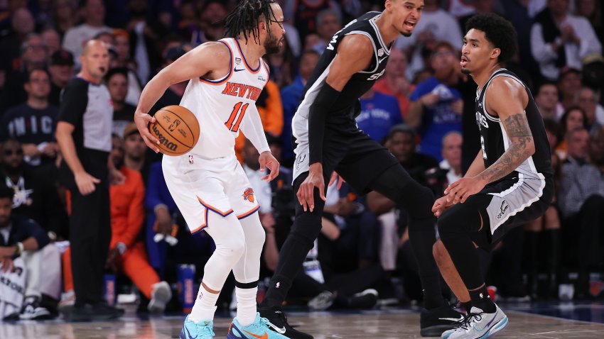 NEW YORK, NEW YORK – JUNE 08: Jalen Brunson #11 of the New York Knicks works against Dylan Harper #2 and Victor Wembanyama #1 of the San Antonio Spurs during the third quarter in Game Three of the 2026 NBA Finals at Madison Square Garden on June 08, 2026 in New York City. NOTE TO USER: User expressly acknowledges and agrees that, by downloading and or using this photograph, User is consenting to the terms and conditions of the Getty Images License Agreement. (Photo by Al Bello/Getty Images)