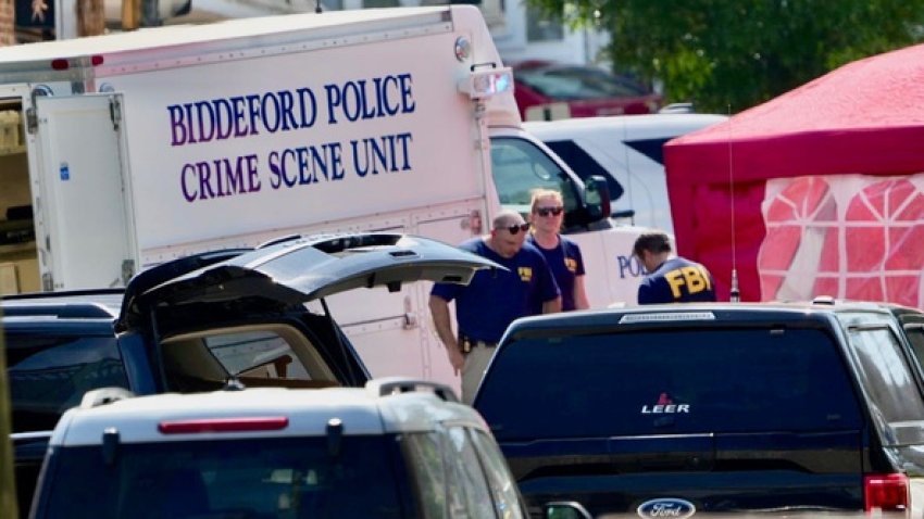 Investigators are seen in Biddeford, Maine, on Monday, July 13, 2026 following reports of a fatal shooting.